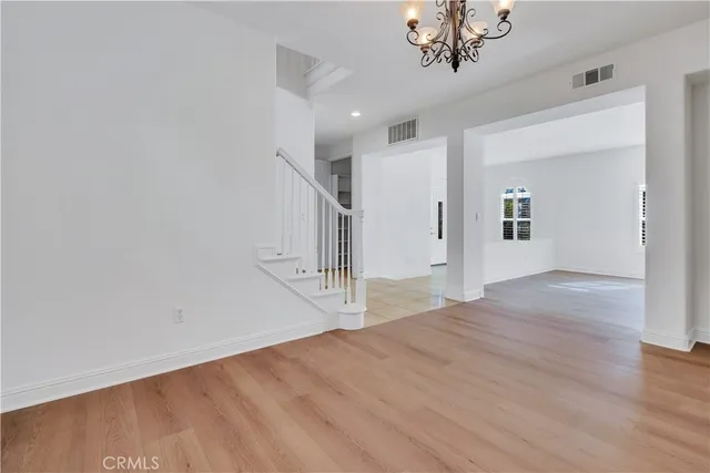 a spacious bathroom with a granite countertop sink a mirror and a shower