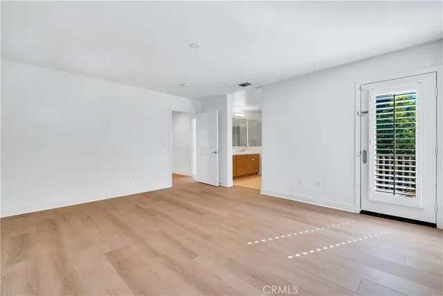 a bathroom with double sink and a mirror
