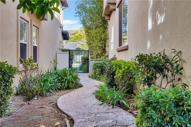 a house is sitting in middle od the grass