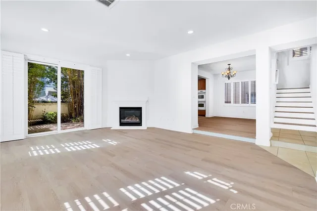 a view of a back yard from a corridor