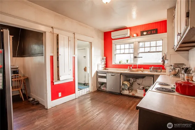 a room with furniture and wooden floor