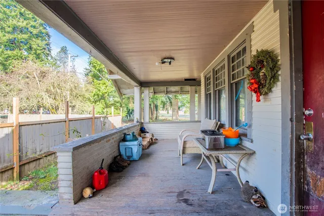 a view of a house with swimming pool and sitting area