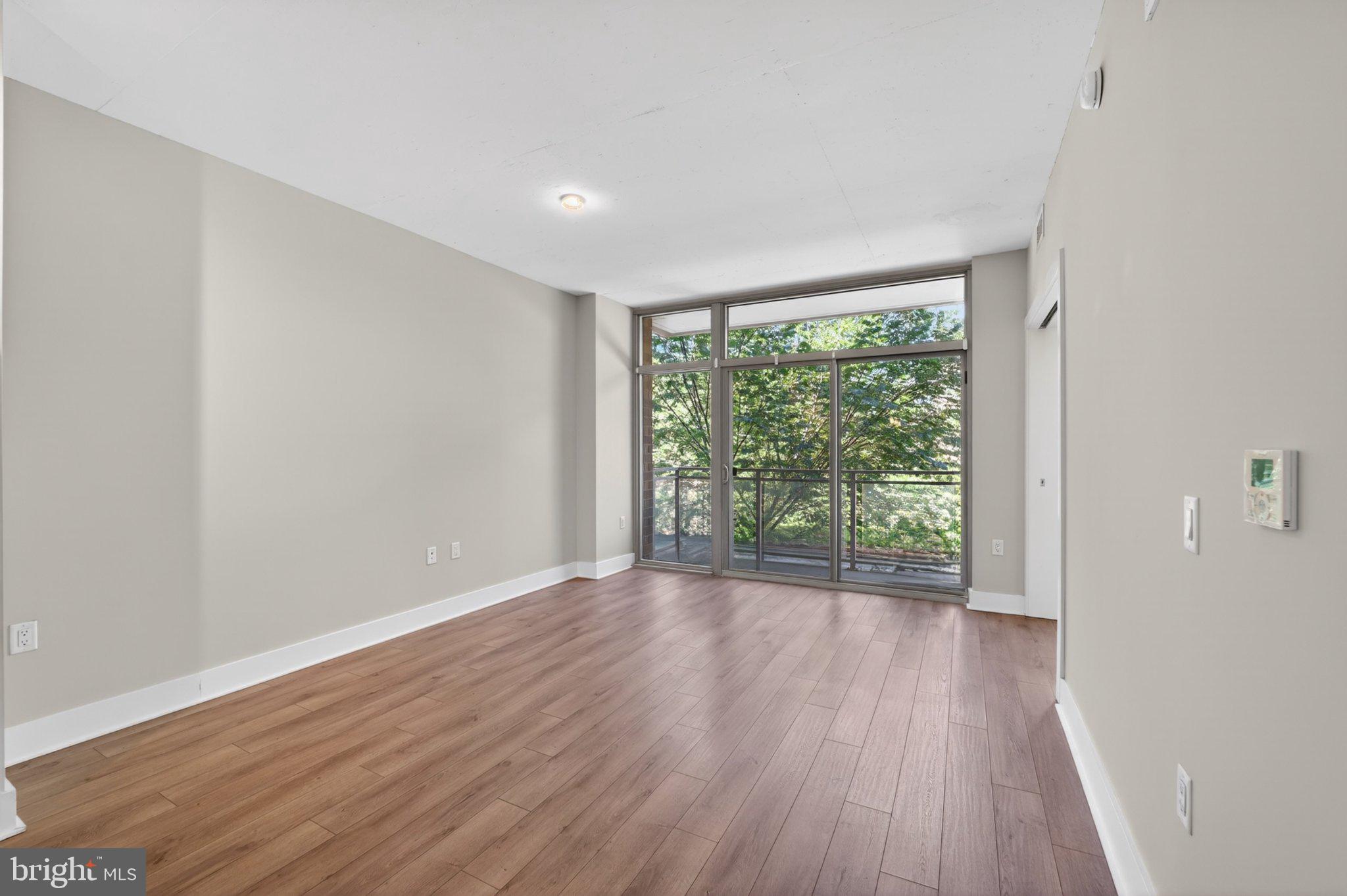 88 V Street Southwest, Unit 213 Washington, DC 20024 - Photo 14 of 26 Bright and airy living space awaits.