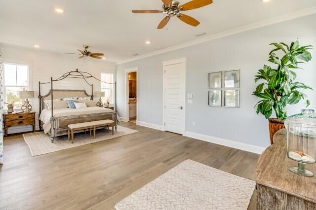 21 Pleasant St Inlet Beach Inlet Beach, FL 32461 - Photo 14 of 27 a spacious bedroom with a bed and a chandelier