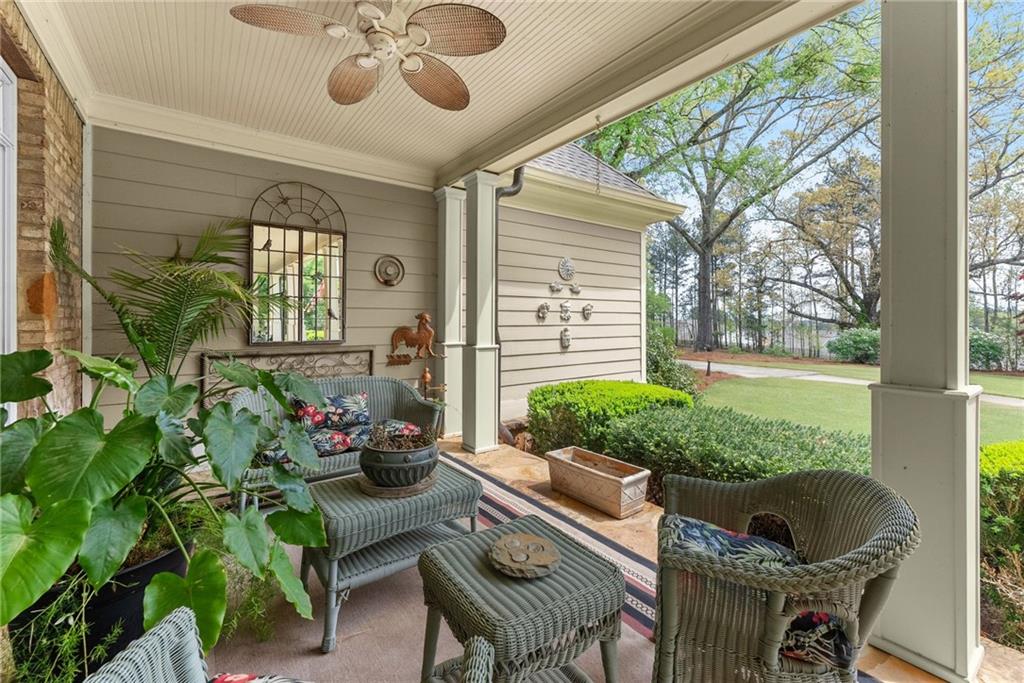 594 Peachtree Road Hoschton, GA 30548 - Photo 16 of 96 a outdoor living space with furniture and a garden