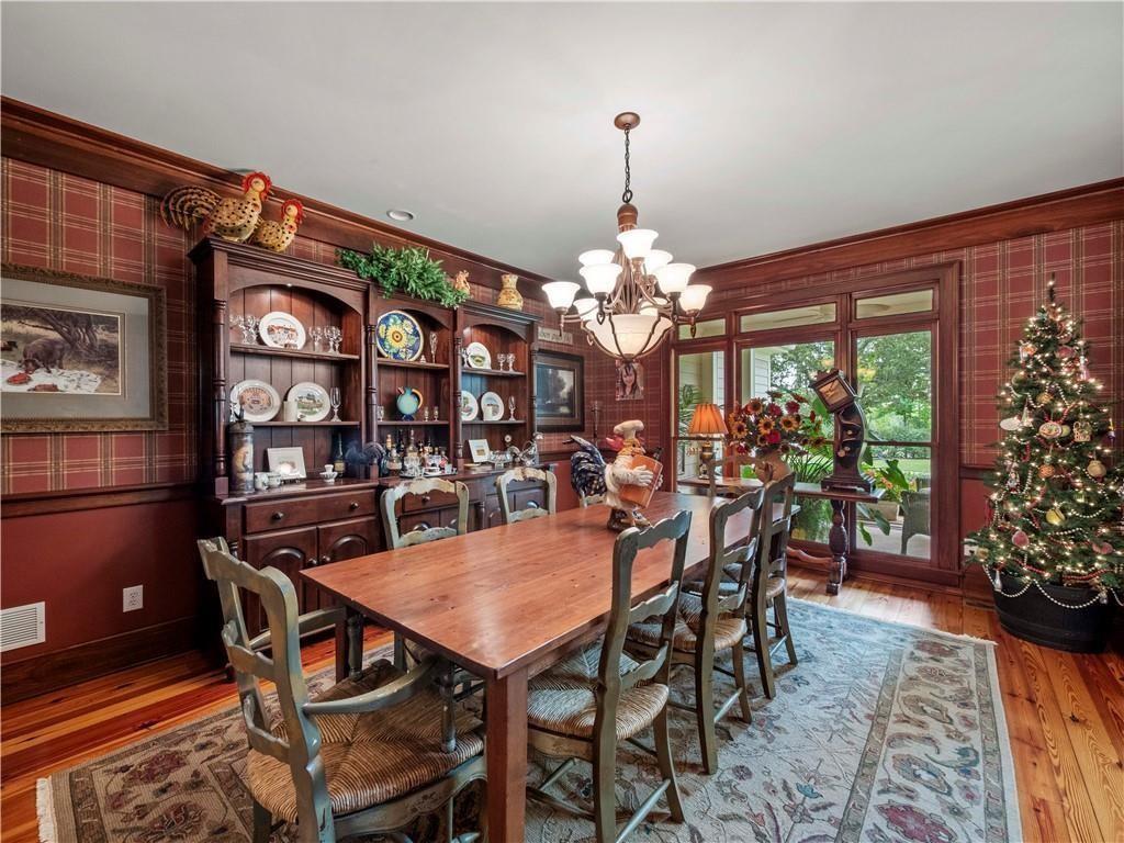594 Peachtree Road Hoschton, GA 30548 - Photo 32 of 96 a view of a dining room with furniture and chandelier