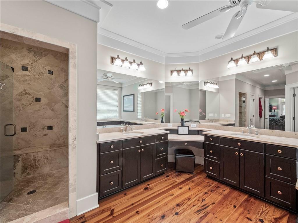 594 Peachtree Road Hoschton, GA 30548 - Photo 39 of 96 a large bathroom with a sink and a large mirror