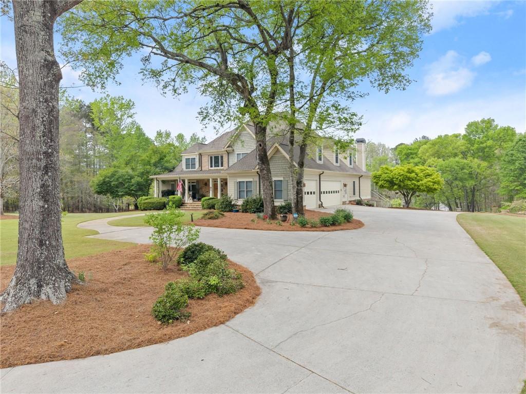 594 Peachtree Road Hoschton, GA 30548 - Photo 4 of 96 a view of swimming pool with outdoor seating and yard