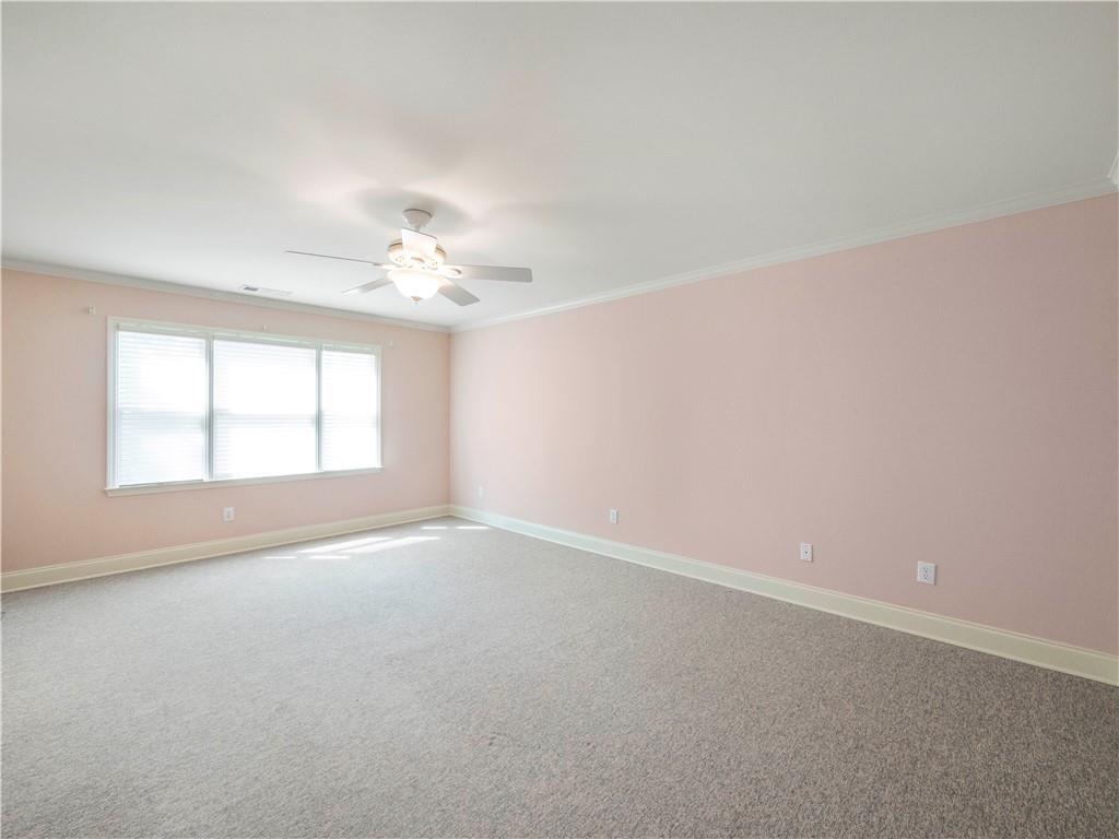 594 Peachtree Road Hoschton, GA 30548 - Photo 55 of 96 an empty room with a window and a ceiling fan