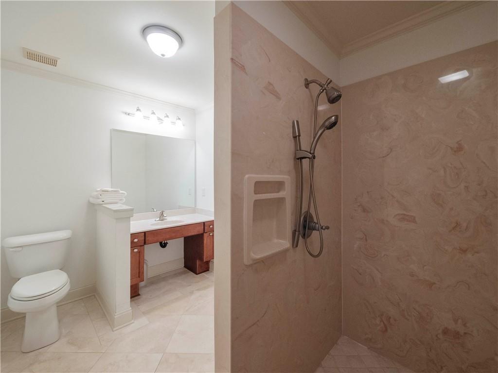 594 Peachtree Road Hoschton, GA 30548 - Photo 57 of 96 a bathroom with a toilet sink and shower