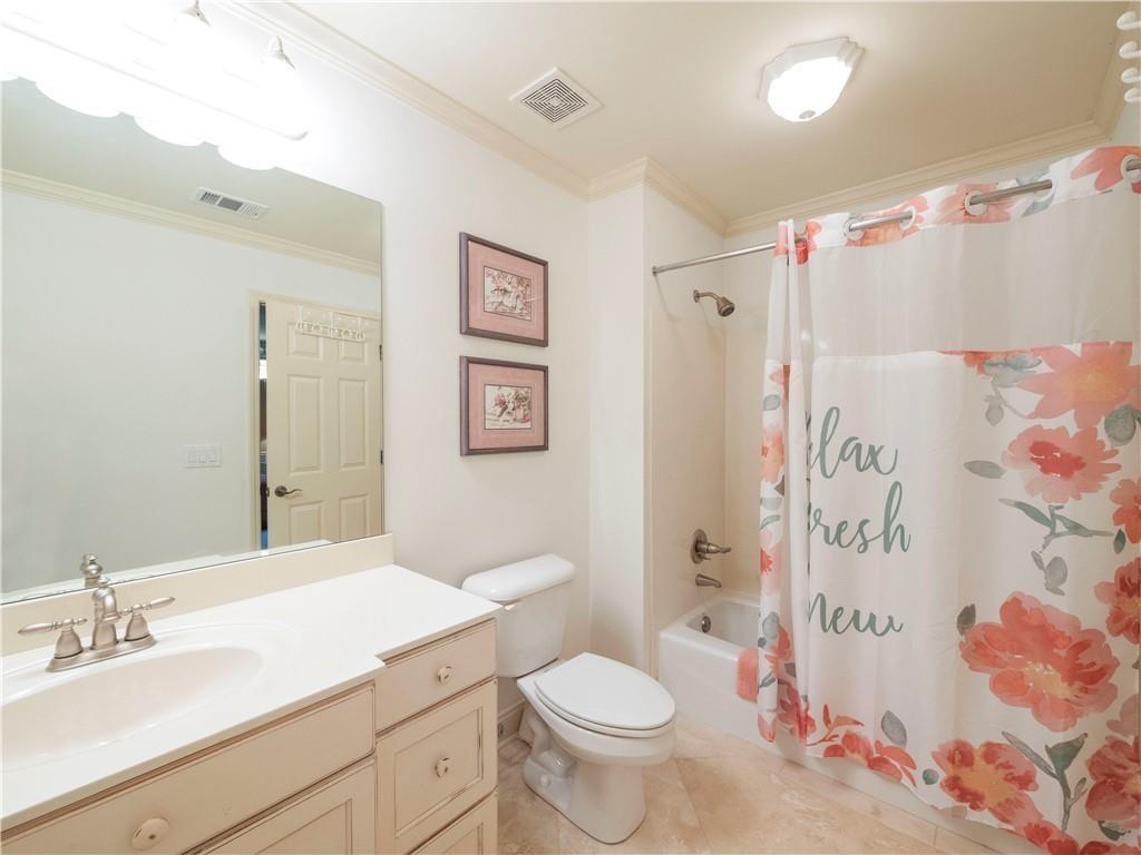 594 Peachtree Road Hoschton, GA 30548 - Photo 60 of 96 a bathroom with a sink toilet and shower