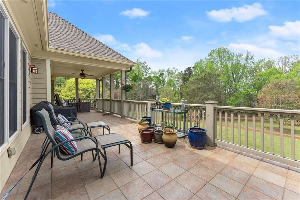 594 Peachtree Road Hoschton, GA 30548 - Photo 69 of 96 a view of a chairs and table in the balcony