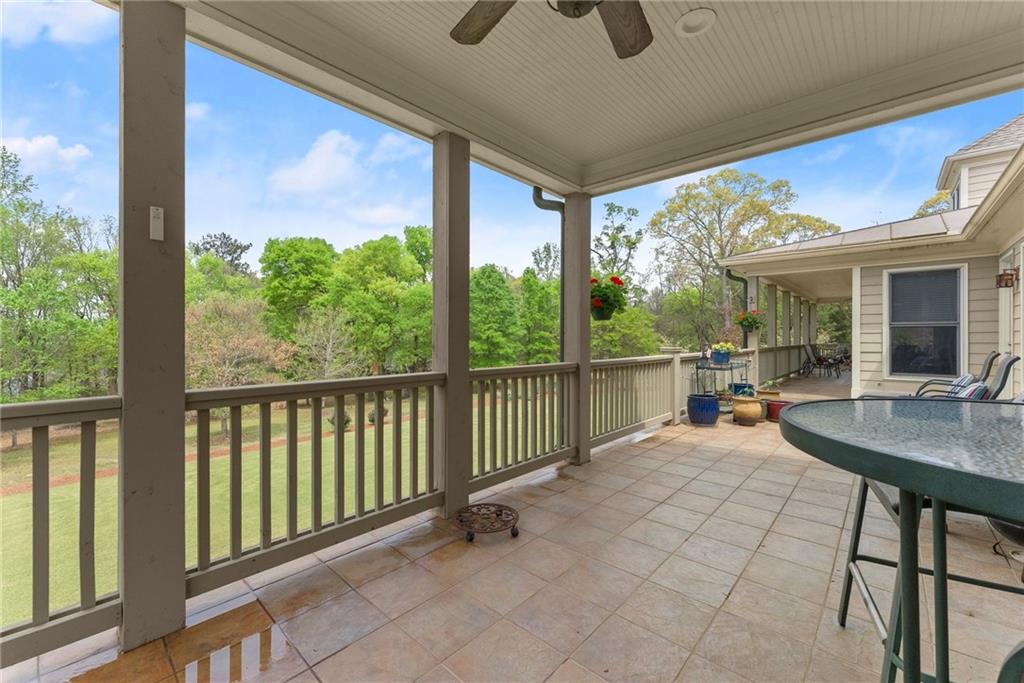 594 Peachtree Road Hoschton, GA 30548 - Photo 72 of 96 a view of a porch with furniture and a yard
