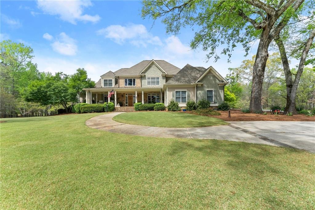 594 Peachtree Road Hoschton, GA 30548 - Photo 9 of 96 a front view of a house with a yard