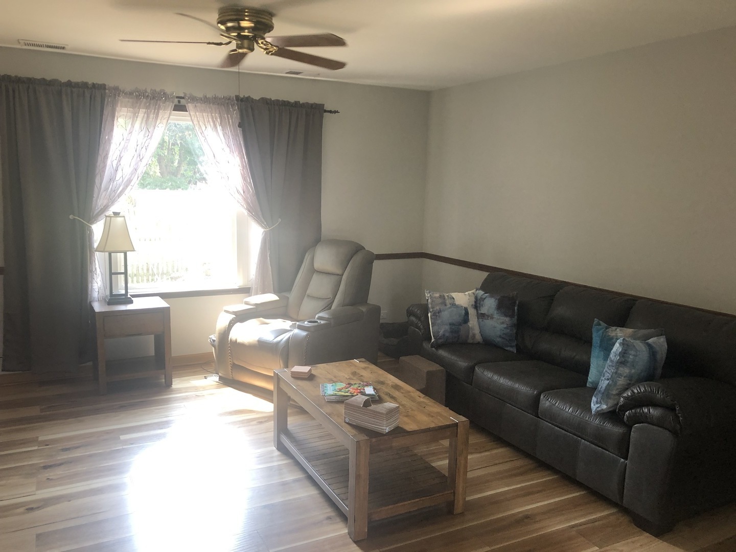 2235 Ridge Avenue Aurora, IL 60504 - Photo 3 of 17 a living room with furniture and a chandelier