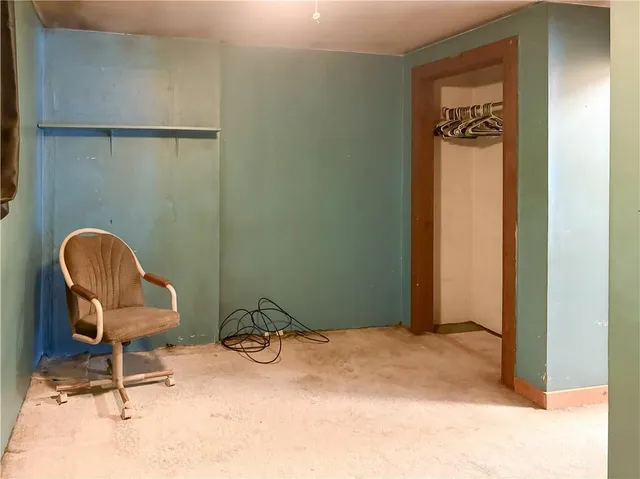 a view of a door and chair in a room