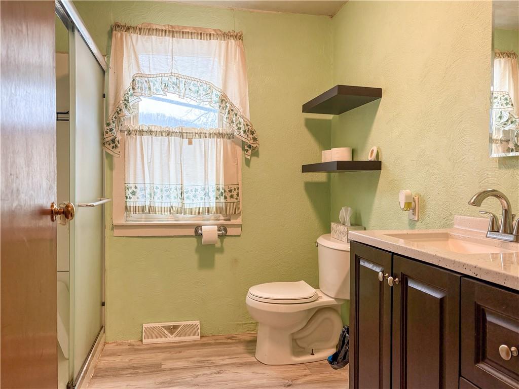 497 Three Mile Hill Mount Pleasant, PA 15666 - Photo 12 of 24 a bathroom with a toilet sink and mirror