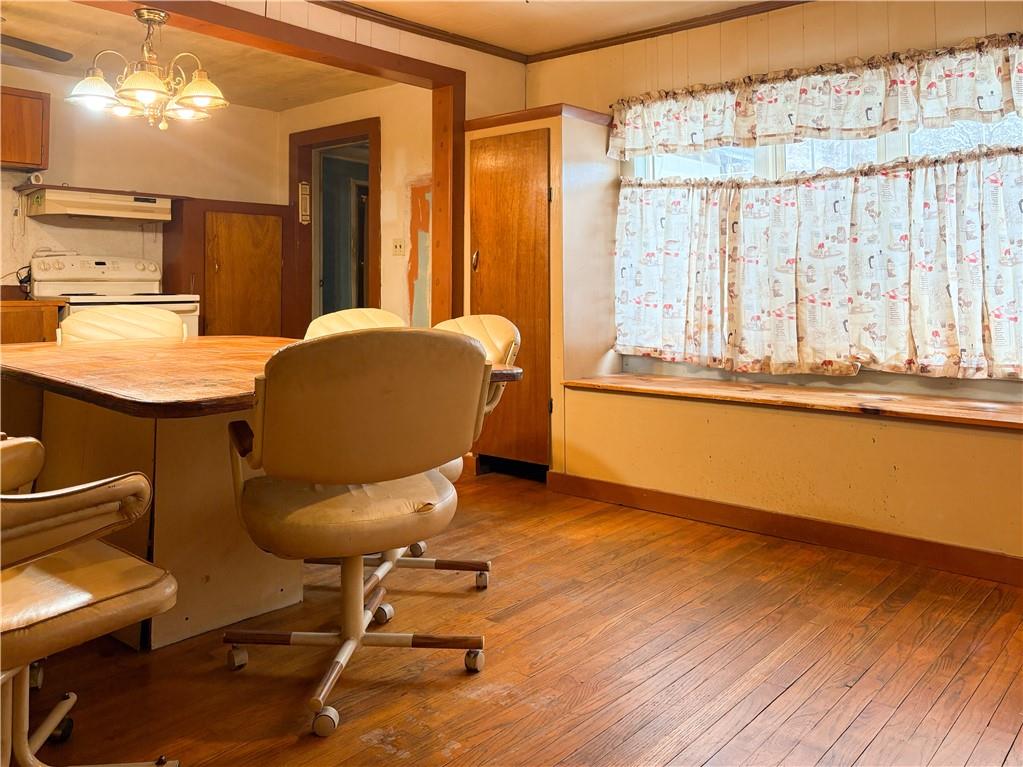 497 Three Mile Hill Mount Pleasant, PA 15666 - Photo 5 of 24 a workspace with furniture and a window