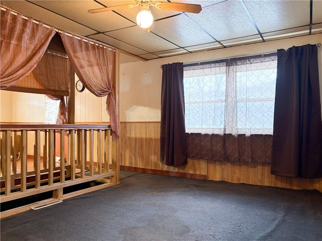 497 Three Mile Hill Mount Pleasant, PA 15666 - Photo 7 of 24 a view of a room with wooden floor and windows