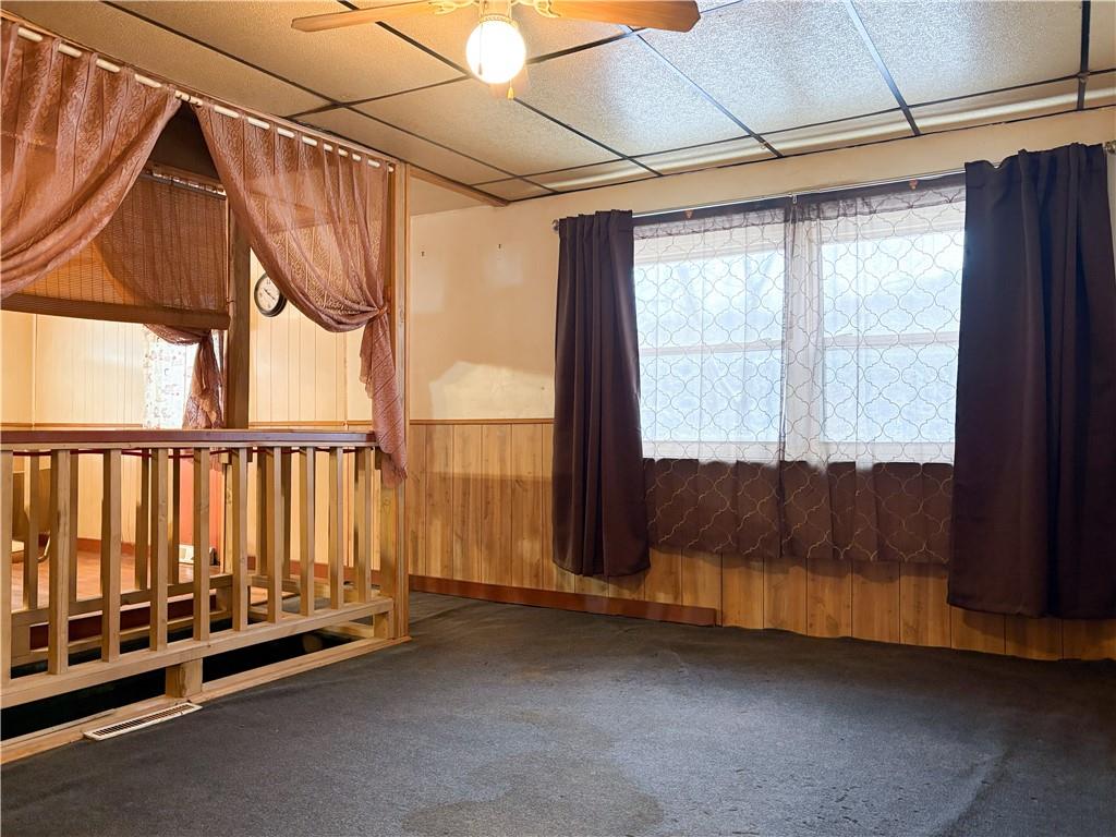 497 Three Mile Hill Mount Pleasant, PA 15666 - Photo 8 of 24 a view of a room with wooden floor and windows