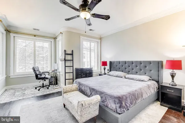 a bedroom with a bed and a couch