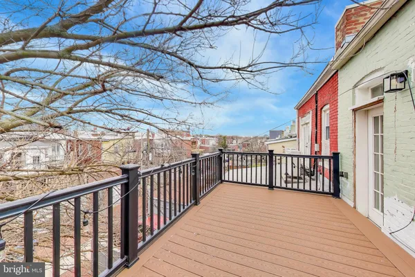 a view of a balcony with wooden floor
