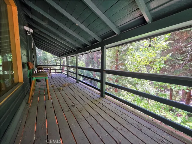 a view of two chairs in the balcony