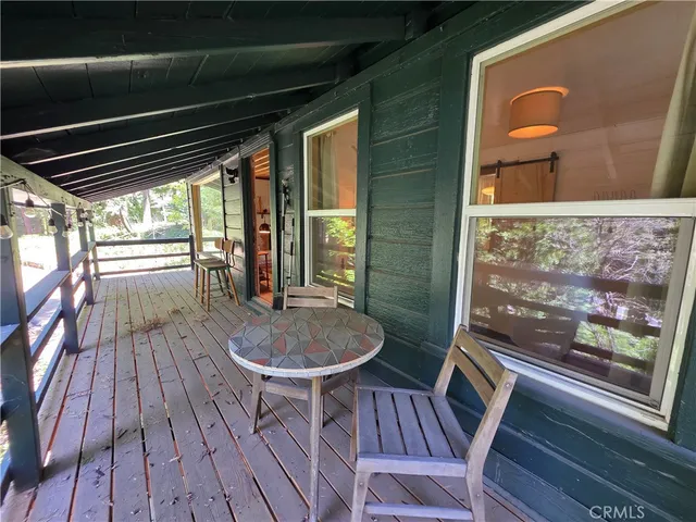 a living room with wooden floor and furniture