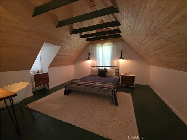 a room with wooden furniture and a window