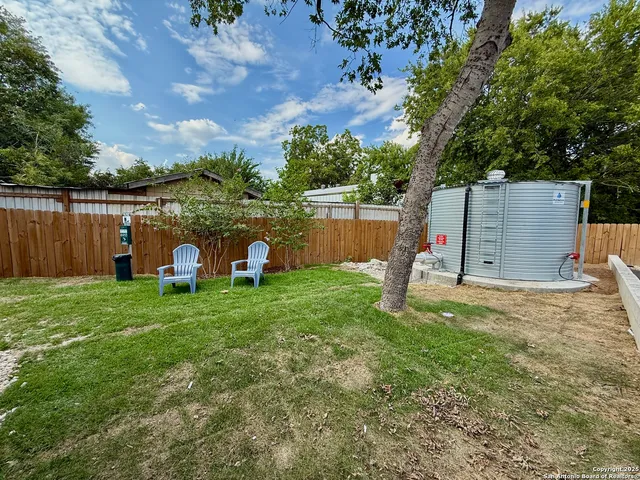 a backyard of a house with lots of green space