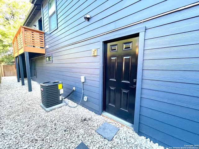 a view of a wooden door and chair