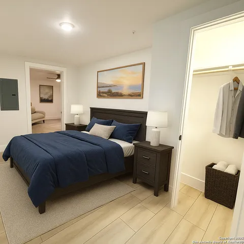 a bedroom with a bed and a couch