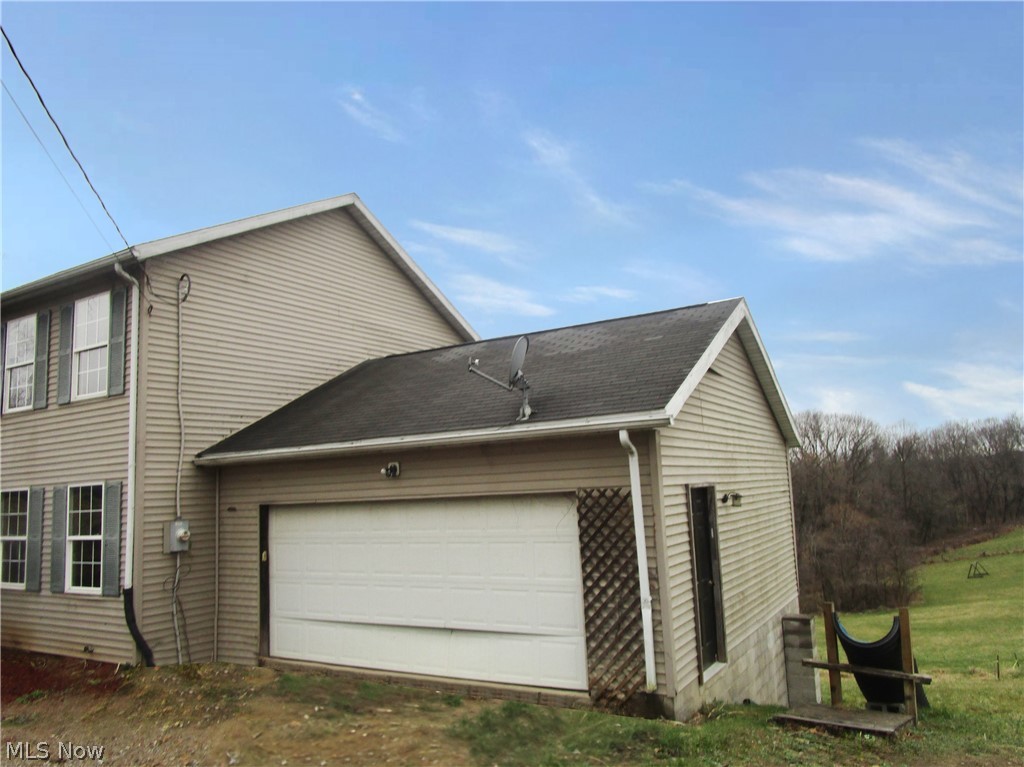 3515 Ridge Road Zanesville, OH 43701 - Photo 4 of 32 View of home's exterior featuring a garage