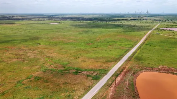 a view of a lake with a big yard
