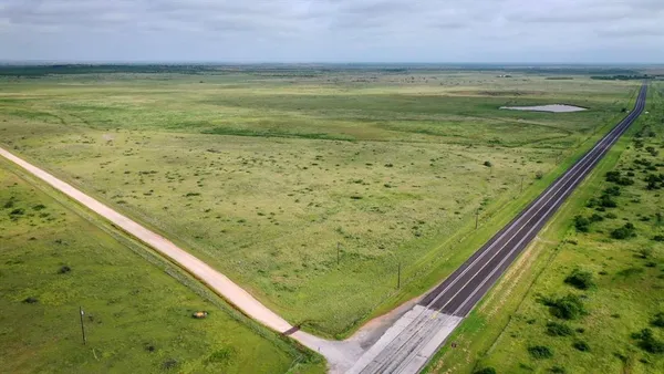 a view of a pool with a yard