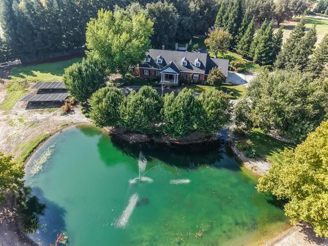 a view of a livingroom with furniture and a fireplace