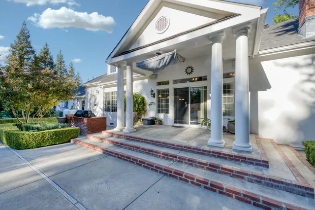 a view of a park with large trees