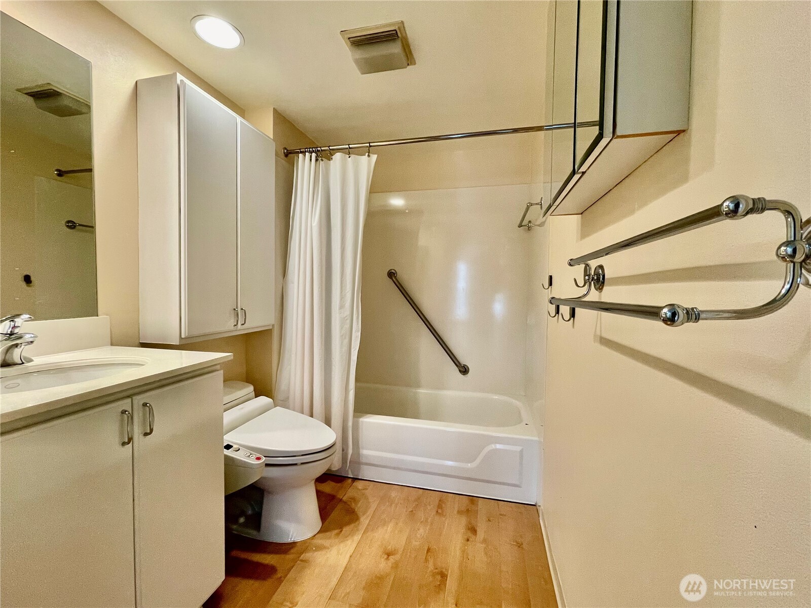 1415 2nd Avenue, Unit 1106 Seattle, WA 98101 - Photo 19 of 30 a bathroom with a sink a toilet and shower