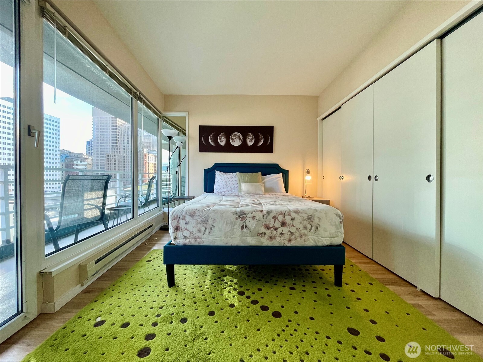 1415 2nd Avenue, Unit 1106 Seattle, WA 98101 - Photo 20 of 30 a bedroom with a bed and a table in it