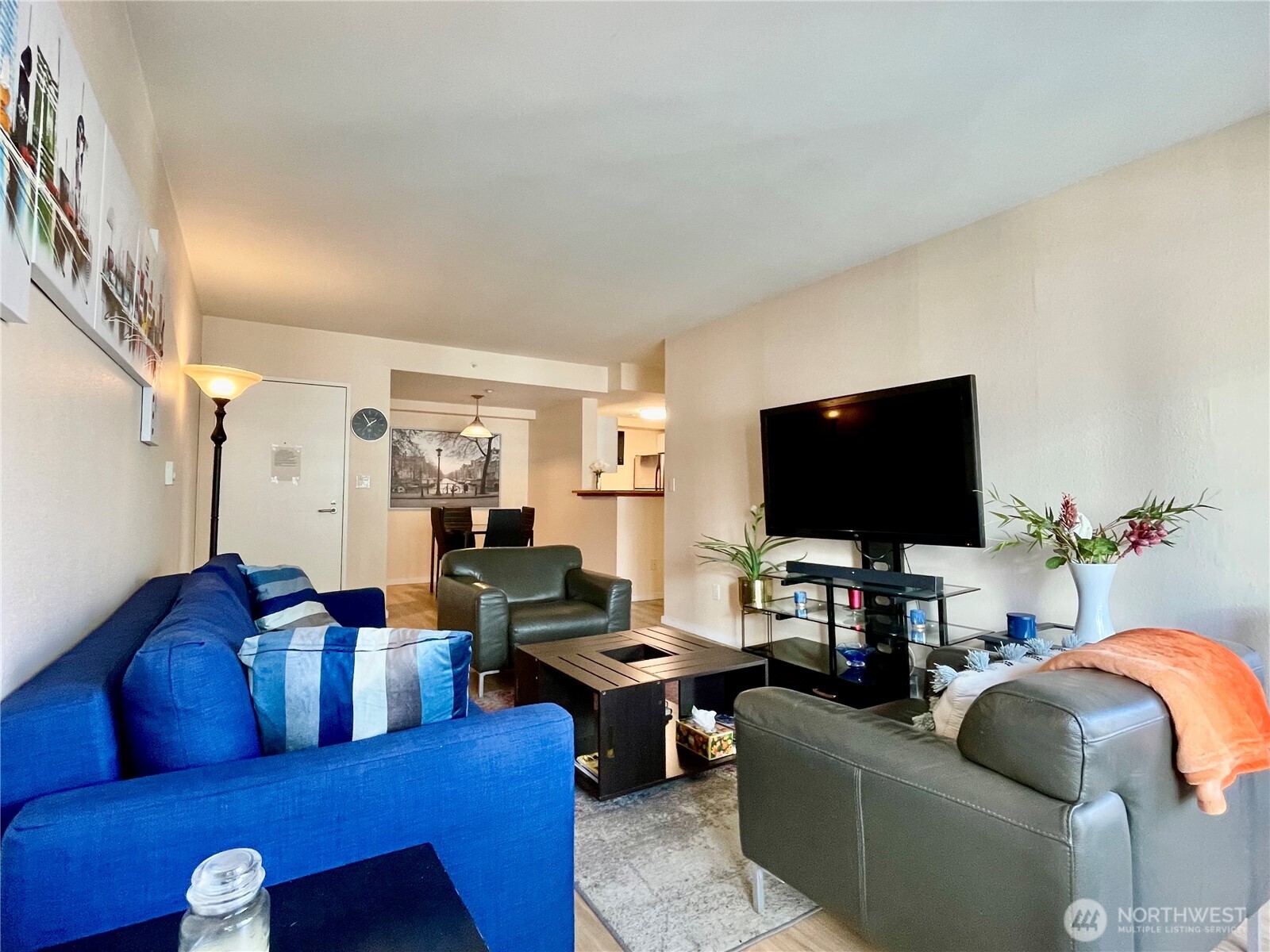 1415 2nd Avenue, Unit 1106 Seattle, WA 98101 - Photo 9 of 30 a living room with furniture and a flat screen tv
