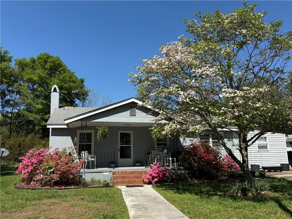 615 Taylor Street Central, SC 29630 - Photo 1 of 16 This charming home offers a welcoming facade with a lovely front porch and vibrant landscaping.