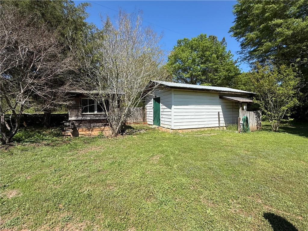 615 Taylor Street Central, SC 29630 - Photo 15 of 16 This outdoor space offers 2 utility buildings. Larger one has electric