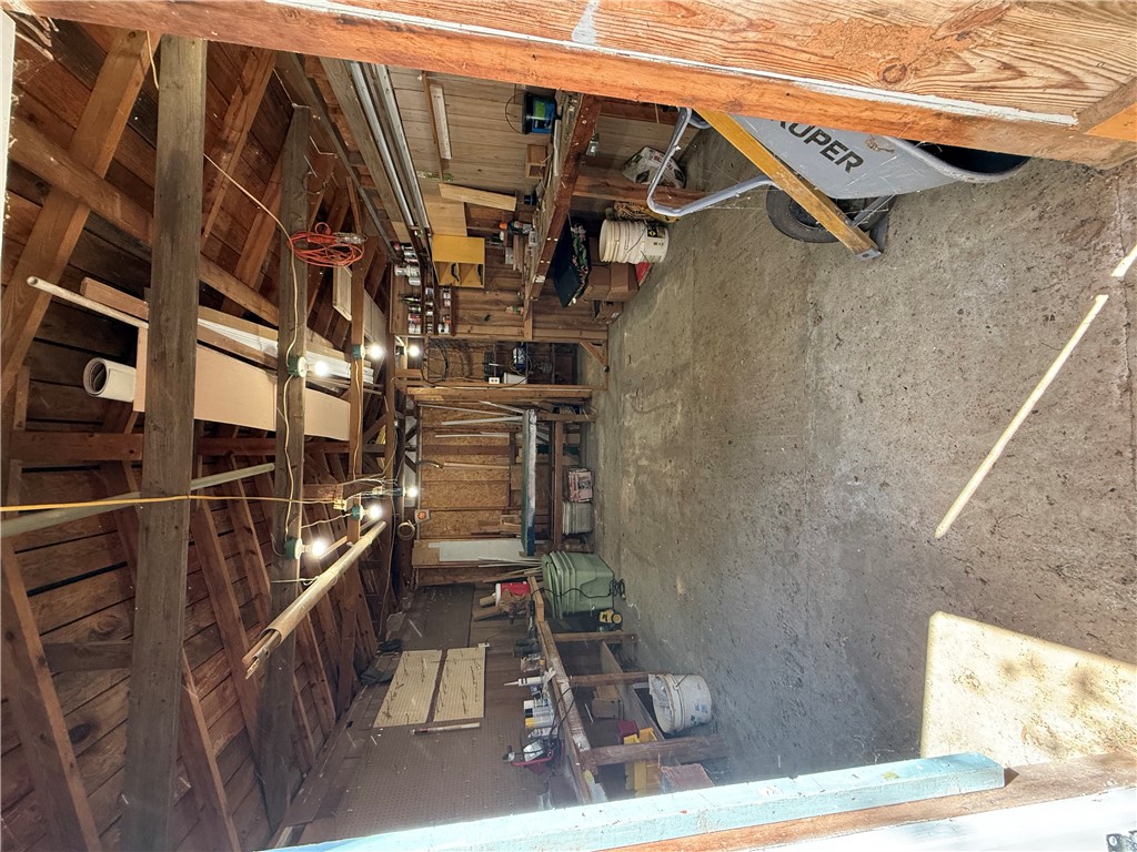 615 Taylor Street Central, SC 29630 - Photo 16 of 16 This spacious interior offers versatile potential for storage or renovation projects. Electric run to building.