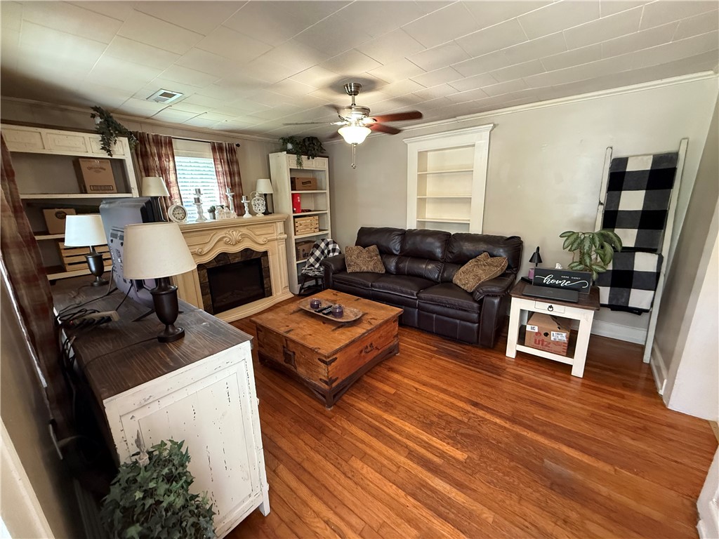 615 Taylor Street Central, SC 29630 - Photo 4 of 16 Inviting living room with built in bookcase. (fireplace is electric and will not be with sale of home)