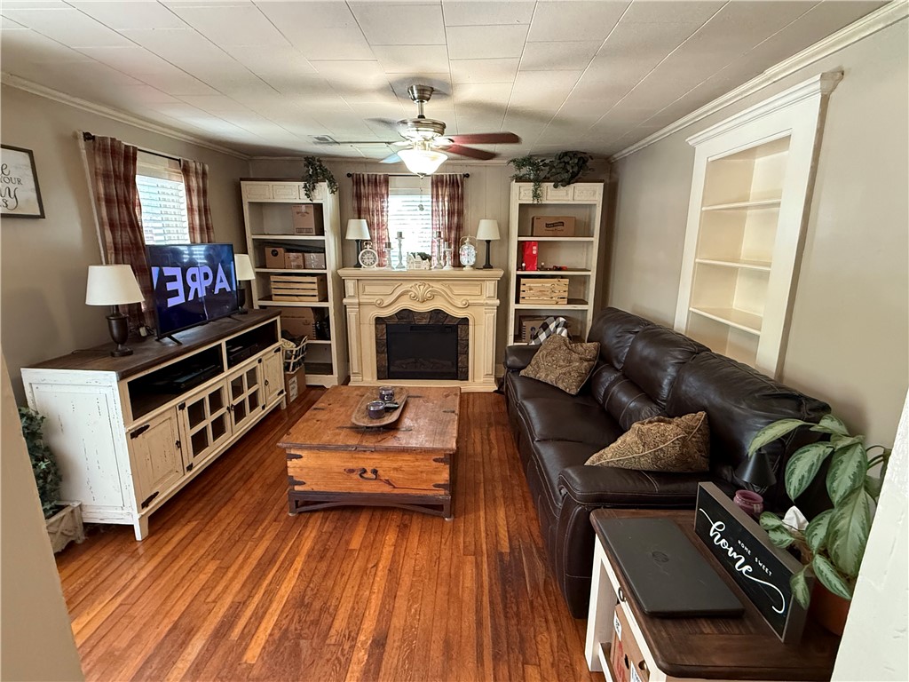 615 Taylor Street Central, SC 29630 - Photo 5 of 16 This inviting living space features warm hardwood floors (fireplace is not included in sale. Stand-alone electric fireplace)