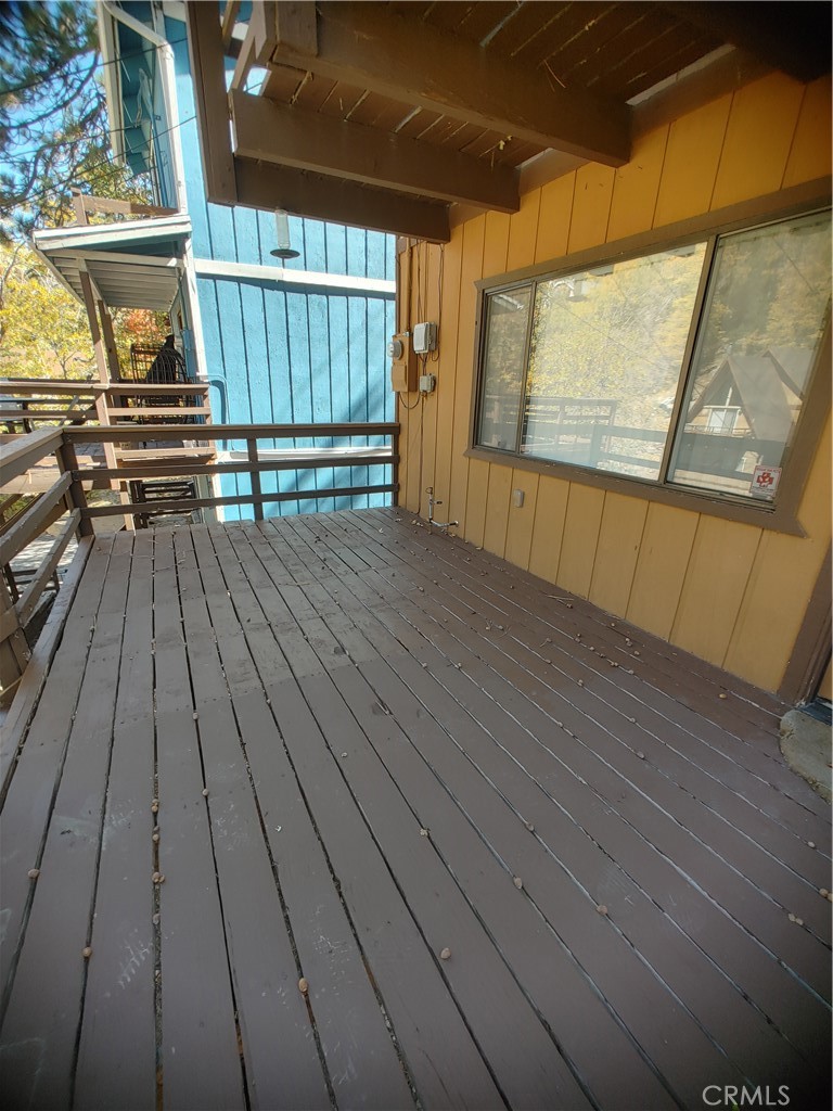 a view of outdoor space with wooden floor