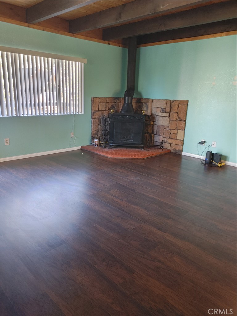 32981 Deer Lane Running Springs, CA 92382 - Photo 3 of 16 a room with wooden floor and windows