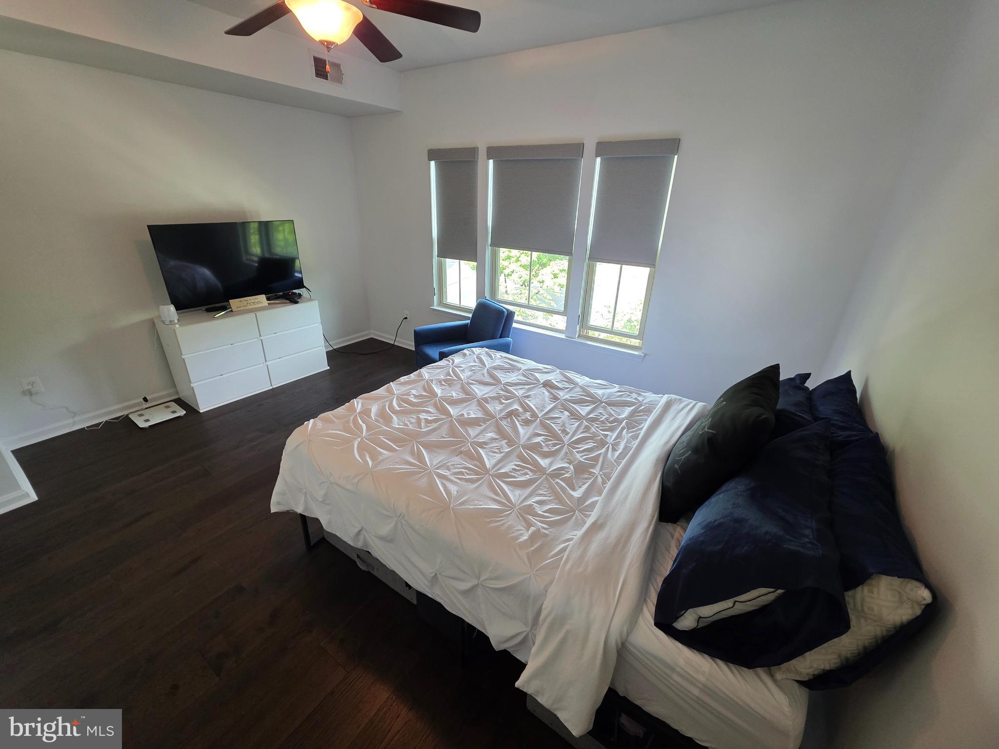 43815 Stubble Cor Square Ashburn, VA 20147 - Photo 12 of 23 a bedroom with a bed and a flat screen tv