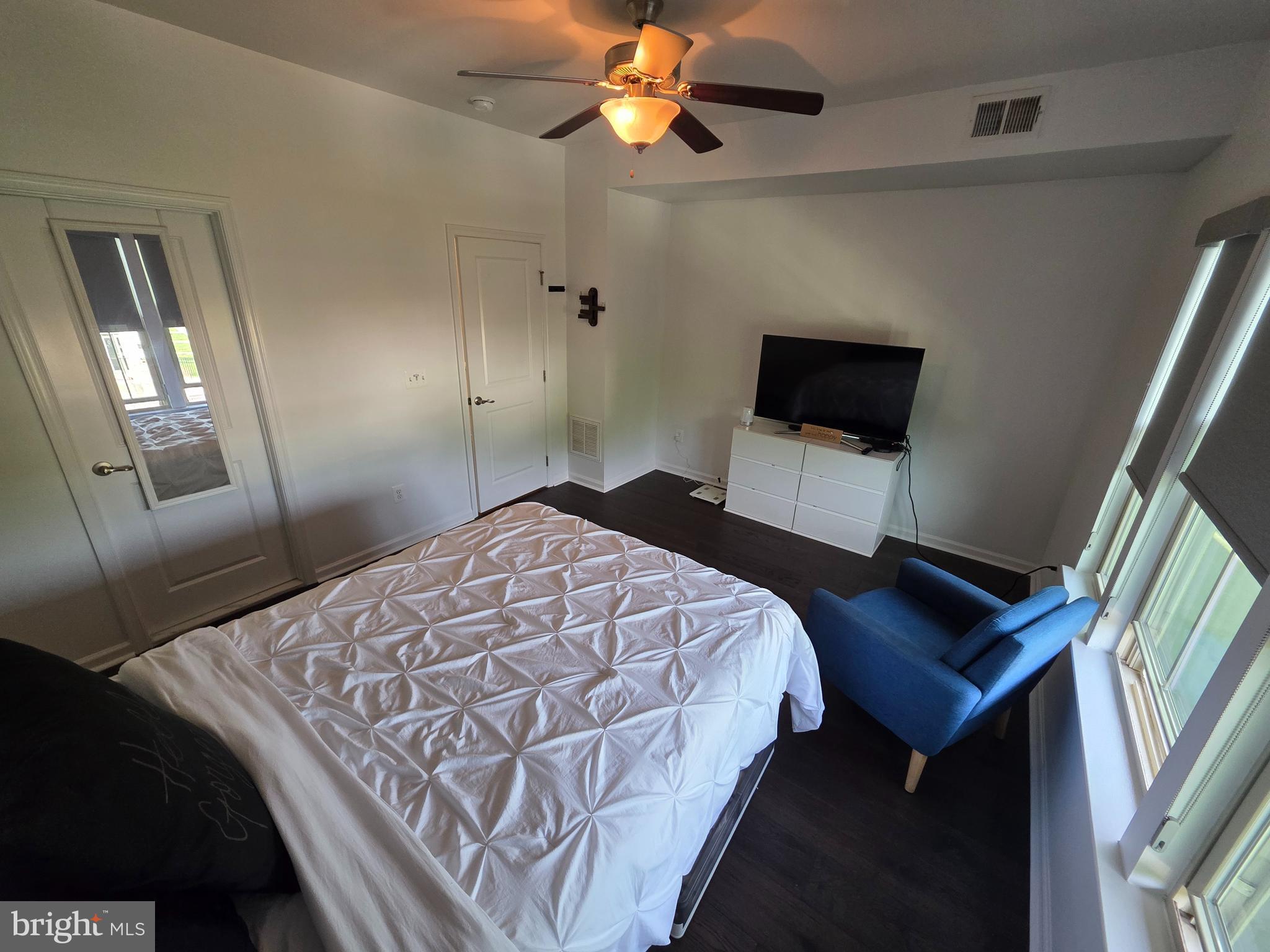 43815 Stubble Cor Square Ashburn, VA 20147 - Photo 13 of 23 a bedroom with a bed and a television