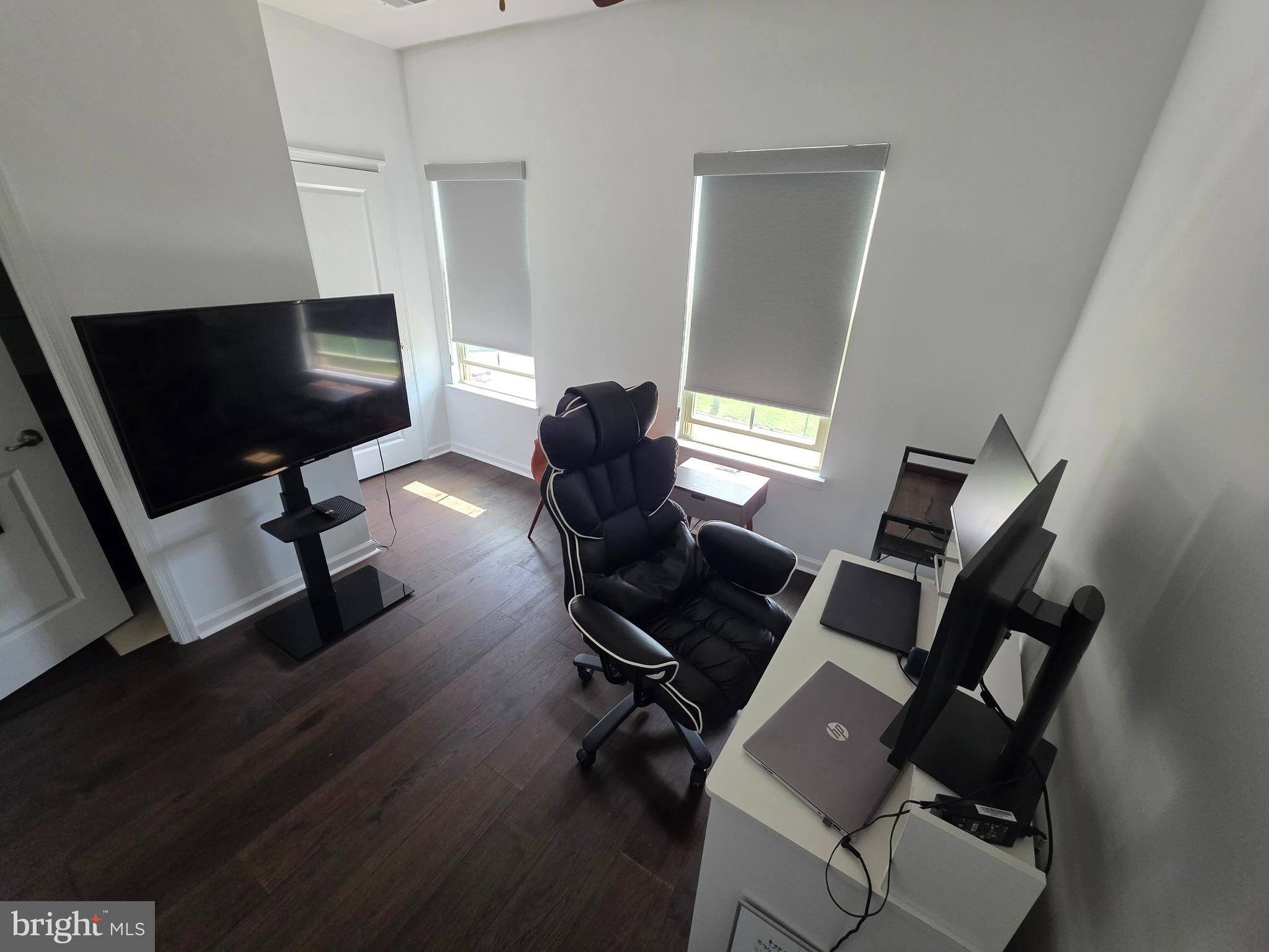 43815 Stubble Cor Square Ashburn, VA 20147 - Photo 15 of 23 a living room with furniture and a flat screen tv